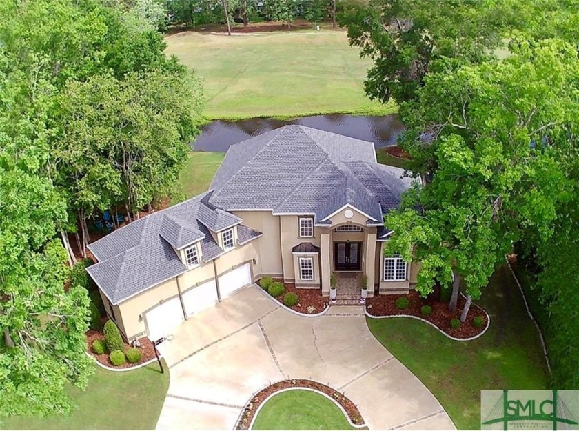 Nestled in a picturesque setting, this stunning two-story home - Beach Home for sale in Savannah, Georgia on Beachhouse.com