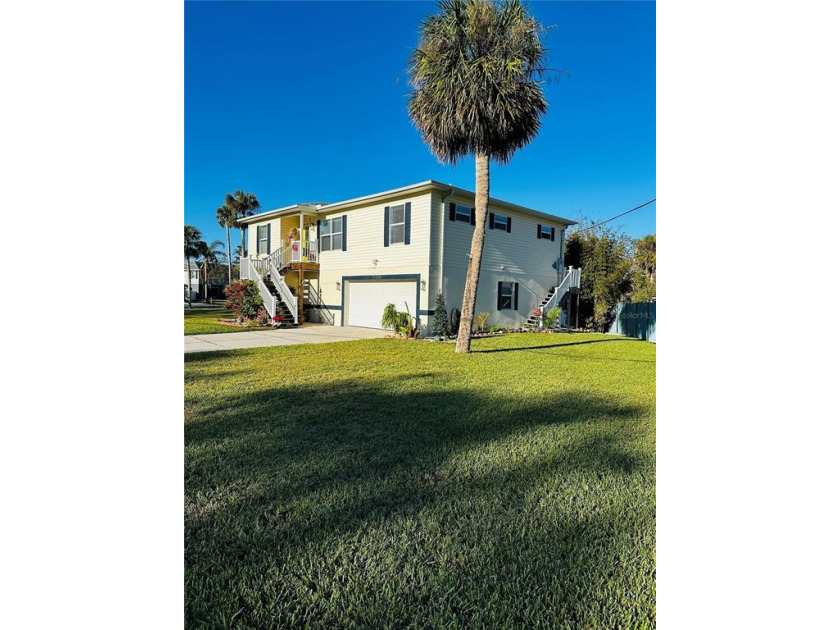 Elevated WITH Elevator on oversized corner lot in trendy New - Beach Home for sale in New Port Richey, Florida on Beachhouse.com