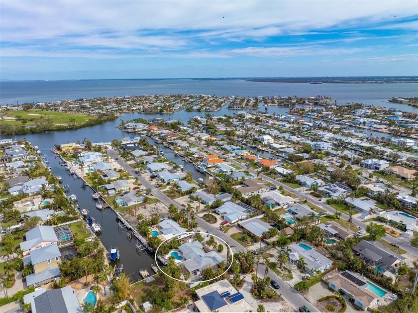 This charming three-bedroom, three-bathroom pool home situated - Beach Home for sale in Holmes Beach, Florida on Beachhouse.com