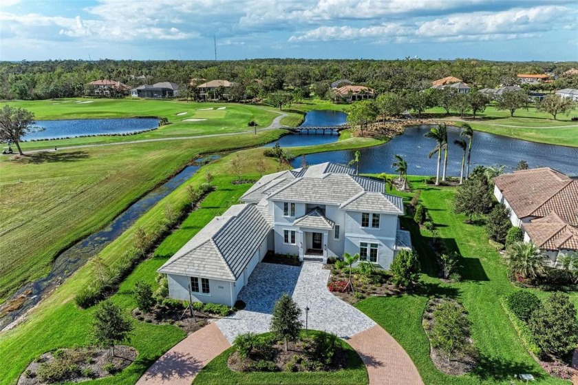 Stunning lake and golf course views are the backdrop for this - Beach Home for sale in Sarasota, Florida on Beachhouse.com