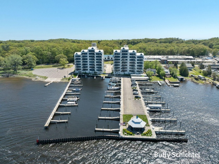 Experience stunning panoramic views of Muskegon Lake from this - Beach Condo for sale in Muskegon, Michigan on Beachhouse.com