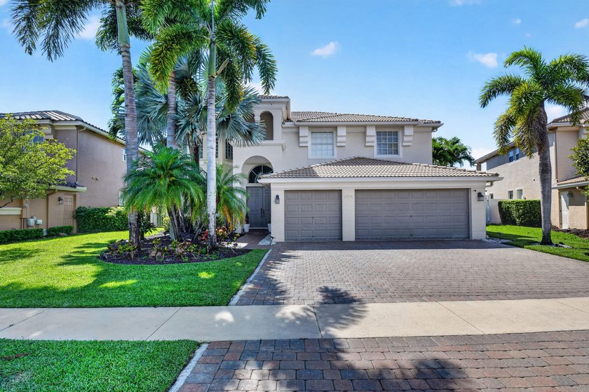 Welcome to 2214 Ridgewood Circle - an exceptional lakefront - Beach Home for sale in Royal Palm Beach, Florida on Beachhouse.com
