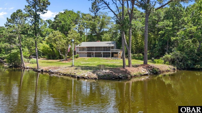 With 450+ feet of canal frontage, this unique 4-bedroom, 2-bath - Beach Home for sale in Southern Shores, North Carolina on Beachhouse.com