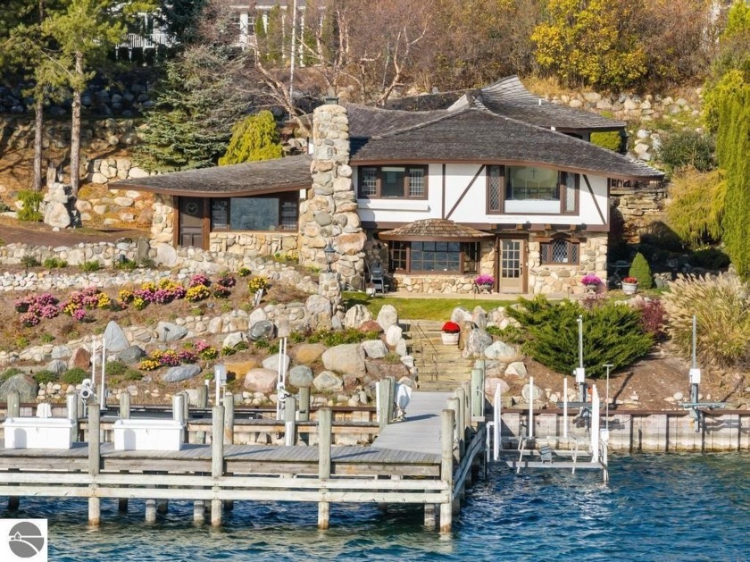 This enchanting 6-bedroom home overlooks Round Lake, the - Beach Home for sale in Charlevoix, Michigan on Beachhouse.com