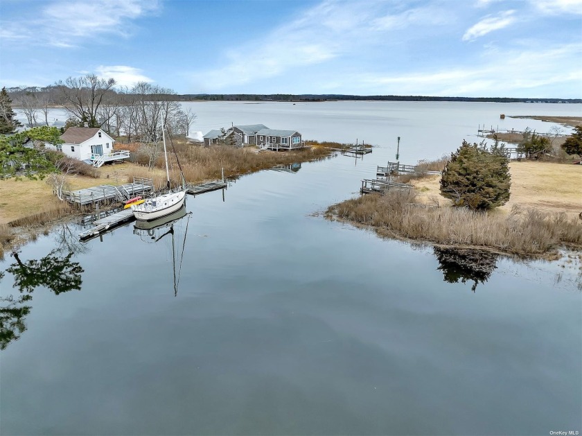 Welcome to your waterfront oasis! This charming Cape style home - Beach Home for sale in Flanders, New York on Beachhouse.com