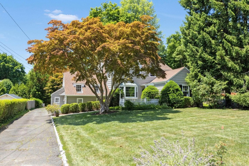 This privately sited 1940s home on a professionally landscaped - Beach Home for sale in Darien, Connecticut on Beachhouse.com