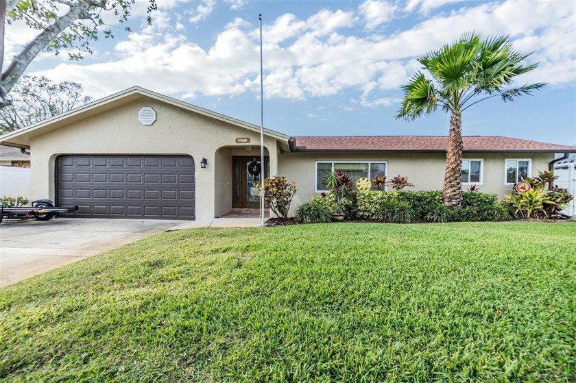 Welcome to this beautiful 4-bedroom, 3-bathroom pool home with a - Beach Home for sale in Seminole, Florida on Beachhouse.com