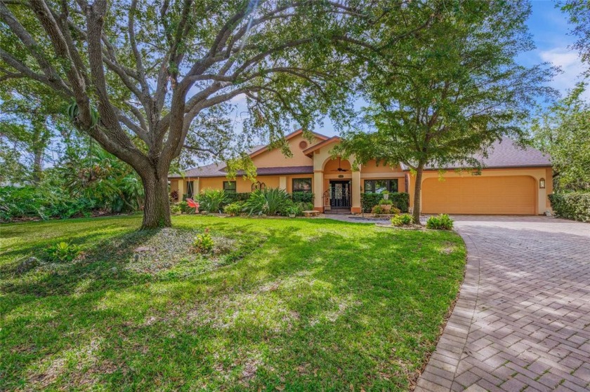 Nestled behind the secure gates of Woodlands II in the - Beach Home for sale in Sarasota, Florida on Beachhouse.com