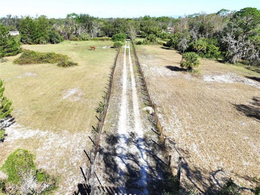 Welcome to your RANCH STYLE sanctuary, located along the Little - Beach Acreage for sale in Ruskin, Florida on Beachhouse.com