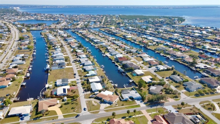 CHARMING 3/2/2 POOL HOME ON SAILBOAT WATER, JUST MINUTES FROM - Beach Home for sale in Port Charlotte, Florida on Beachhouse.com