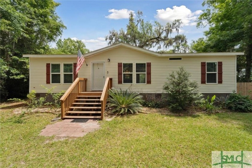 Welcome home to this charming 3-bedroom, 2-bathroom retreat - Beach Home for sale in Midway, Georgia on Beachhouse.com