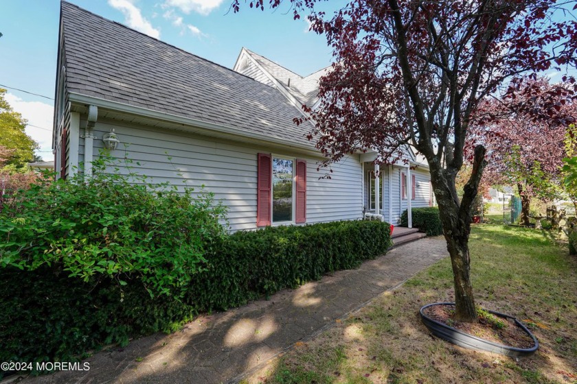 Nestled on a peaceful street, this delightful 3-bedroom, 2-bath - Beach Home for sale in Port Monmouth, New Jersey on Beachhouse.com