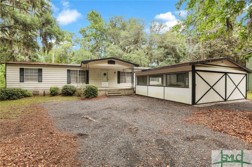 Handyman special. This mobile home sits on a peaceful, wooded - Beach Home for sale in Midway, Georgia on Beachhouse.com