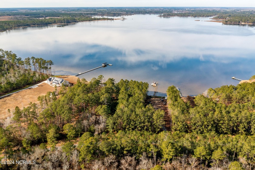 Imagine your dream home on this waterfront beauty.  A lushly - Beach Lot for sale in Merritt, North Carolina on Beachhouse.com