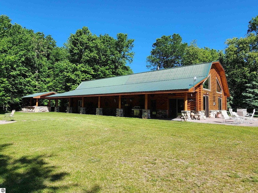 PRIVATE, BEAUTIFUL LOG HOME ON 15 ACRES, with several - Beach Home for sale in Alden, Michigan on Beachhouse.com