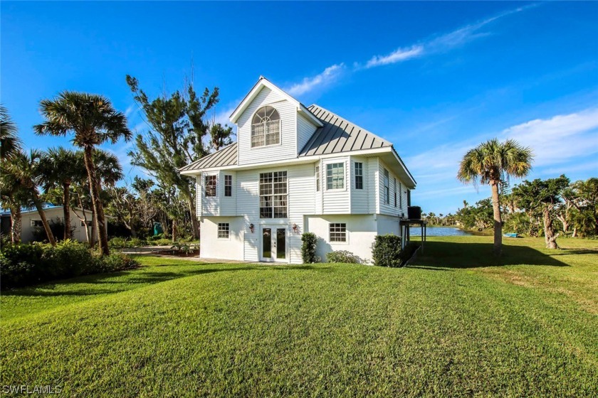 Relax and enjoy the sunsets and wildlife overlooking Palm Lake - Beach Home for sale in Sanibel, Florida on Beachhouse.com