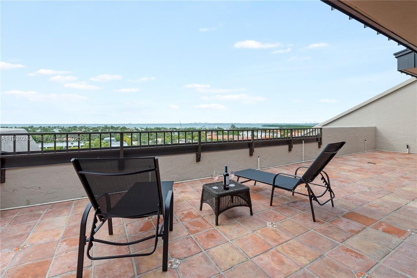 Don't miss the panoramic water views from this thoughtfully - Beach Condo for sale in Key Biscayne, Florida on Beachhouse.com