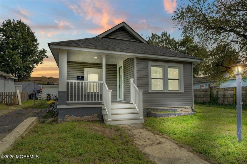 Discover this fully renovated 2-bedroom, 1-bathroom home ideally - Beach Home for sale in Neptune, New Jersey on Beachhouse.com