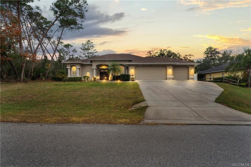 Situated on the 4th fairway of Oak Hills Golf Course, this - Beach Home for sale in Spring Hill, Florida on Beachhouse.com