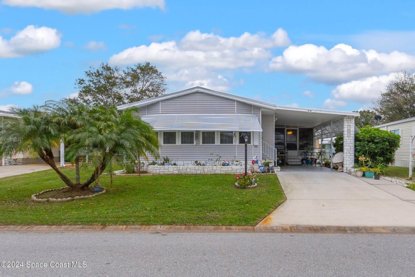 Welcome to this charming 2-bedroom, 2-bathroom manufactured home - Beach Home for sale in Barefoot Bay, Florida on Beachhouse.com