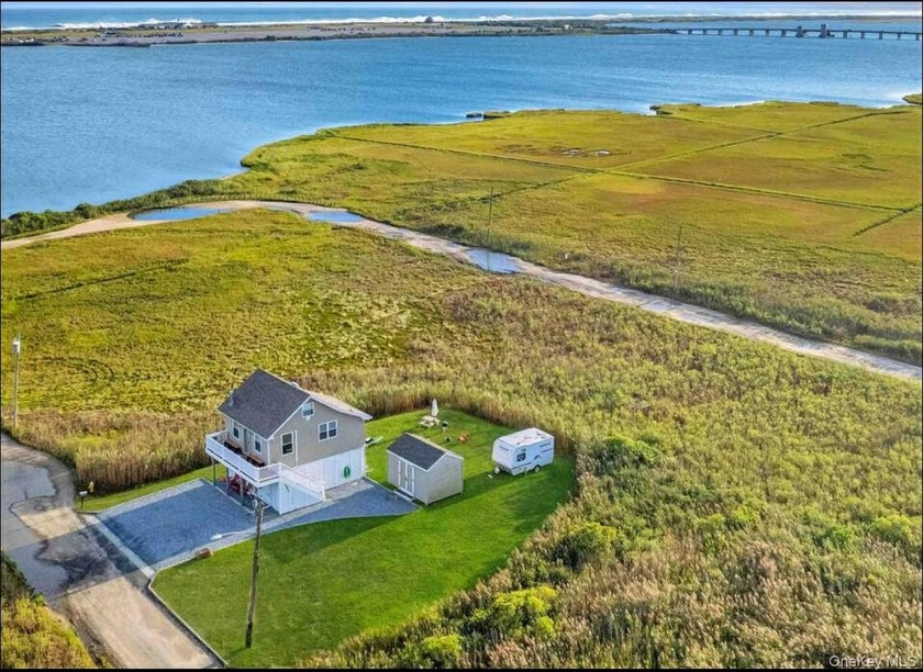Enjoy sweeping bay views from this elevated and energy-efficient - Beach Home for sale in Mastic Beach, New York on Beachhouse.com