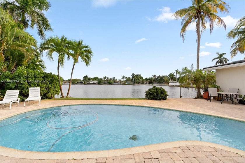 Resort-style waterfront pool estate with no HOA, just 5 minutes - Beach Home for sale in Oakland Park, Florida on Beachhouse.com