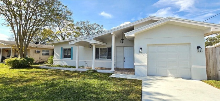 Welcome to a beautifully UPDATED home with NEW ROOF! A welcoming - Beach Home for sale in Clearwater, Florida on Beachhouse.com