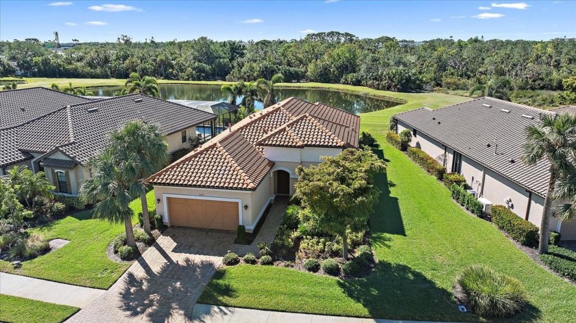 Experience luxury living in this lakefront home. Nestled on a - Beach Home for sale in Sarasota, Florida on Beachhouse.com