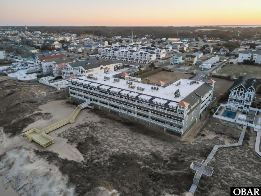 Welcome to Atlantic Splash! This spacious oceanfront First - Beach Condo for sale in Kill Devil Hills, North Carolina on Beachhouse.com