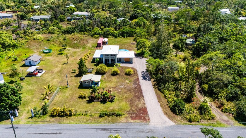 Custom-built home on a lush 1-acre oasis with over 2,500 sq ft - Beach Home for sale in Keaau, Hawaii on Beachhouse.com