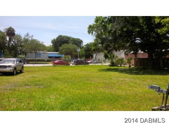 Chain-linked fenced lot with canal on rear of property that - Beach Commercial for sale in Daytona Beach, Florida on Beachhouse.com