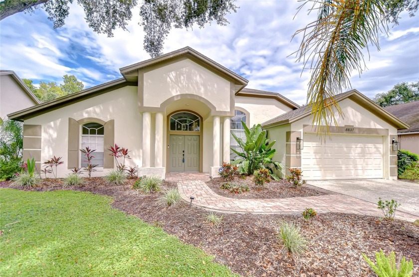Turn-key and move-in ready! This beautifully conserved 4-bedroom - Beach Home for sale in Palm Harbor, Florida on Beachhouse.com
