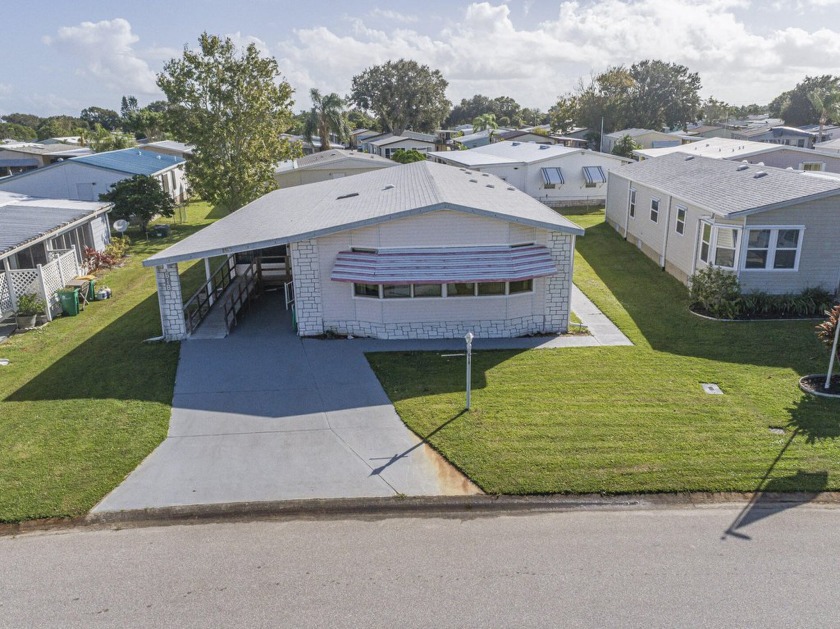 Own your own lot with this well maintained gem of a home in the - Beach Home for sale in Barefoot Bay, Florida on Beachhouse.com