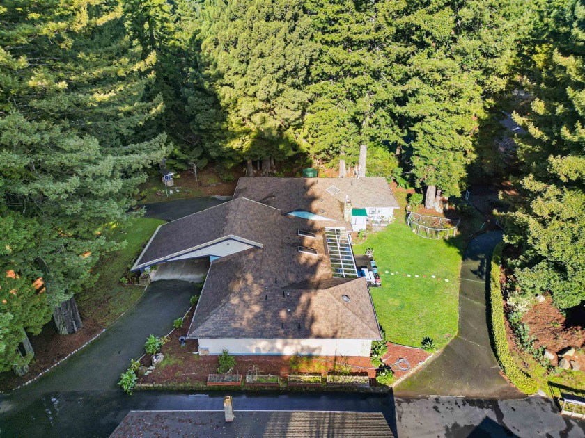 Tucked in the Redwoods on a one-acre lot, this beautiful home - Beach Home for sale in Crescent City, California on Beachhouse.com