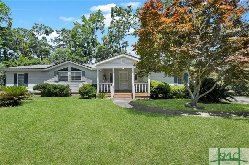Situated on a 0.66-acre lot, this single-story residence offers - Beach Home for sale in Midway, Georgia on Beachhouse.com