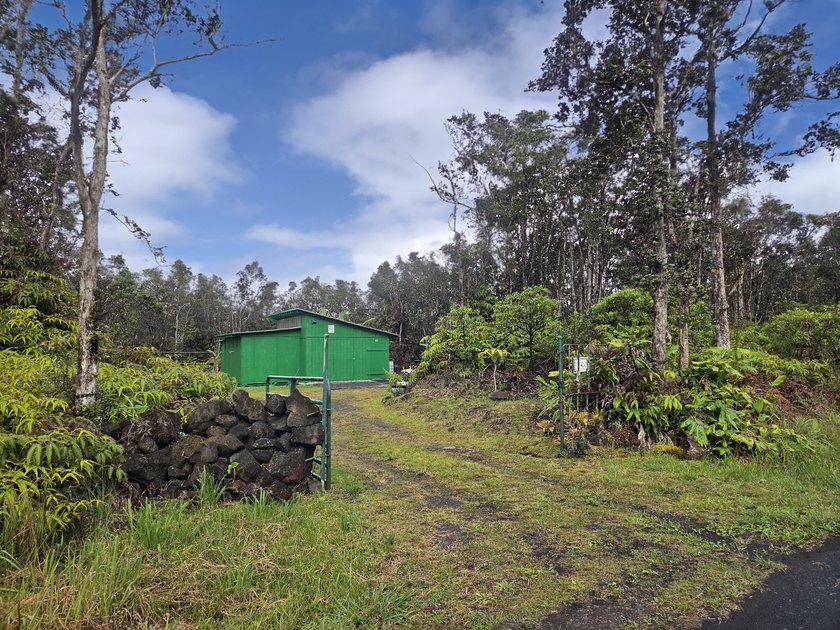 Set behind a gated driveway and surrounded by tropical greenery - Beach Lot for sale in Volcano, Hawaii on Beachhouse.com