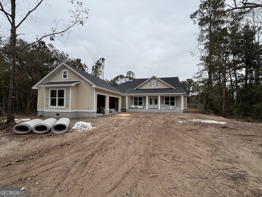 Welcome to this charming four-bed, two and a half bath new - Beach Home for sale in Woodbine, Georgia on Beachhouse.com