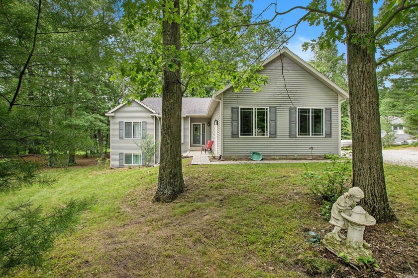 Beautiful 5 bedroom, 3 bath home nestled on a spacious wooded - Beach Home for sale in Mears, Michigan on Beachhouse.com