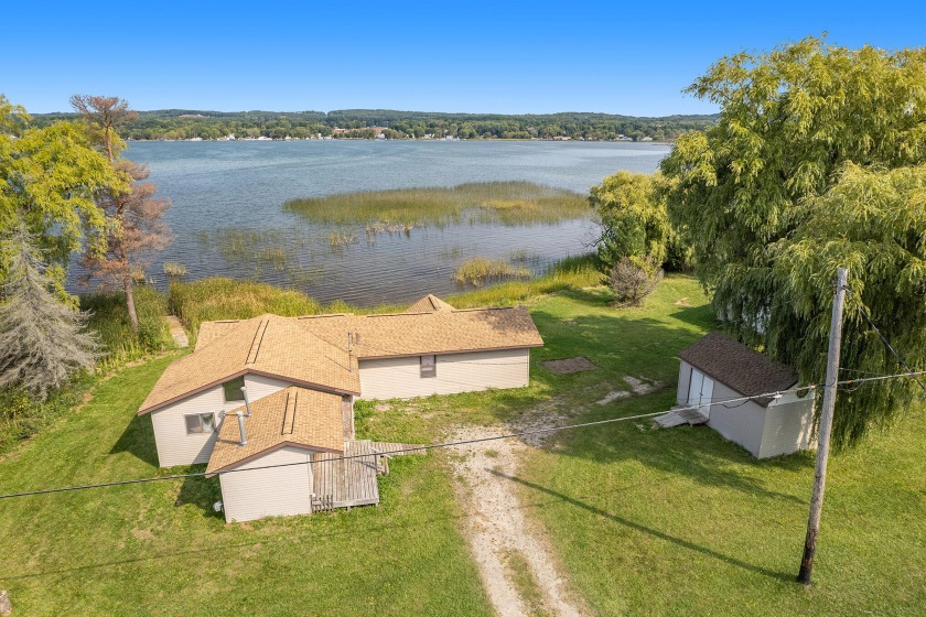 Check out this gorgeous property on Portage Lake protected from - Beach Home for sale in Onekama, Michigan on Beachhouse.com