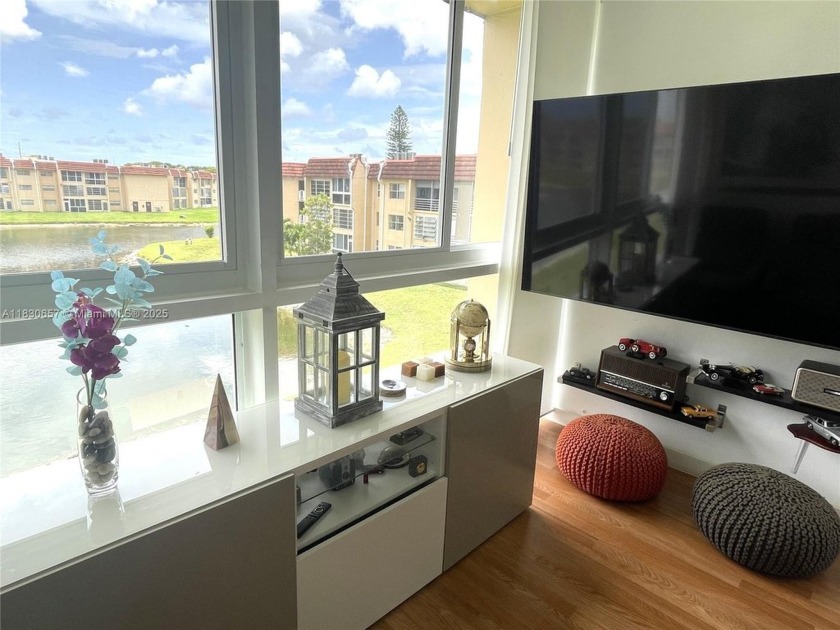 Enjoy serene lake views and resort-style living in this - Beach Condo for sale in Sunrise, Florida on Beachhouse.com