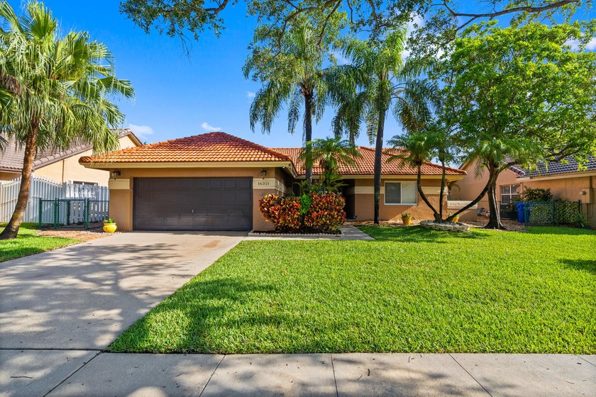 This charming one-story home features a spacious open floor plan - Beach Home for sale in Pembroke Pines, Florida on Beachhouse.com