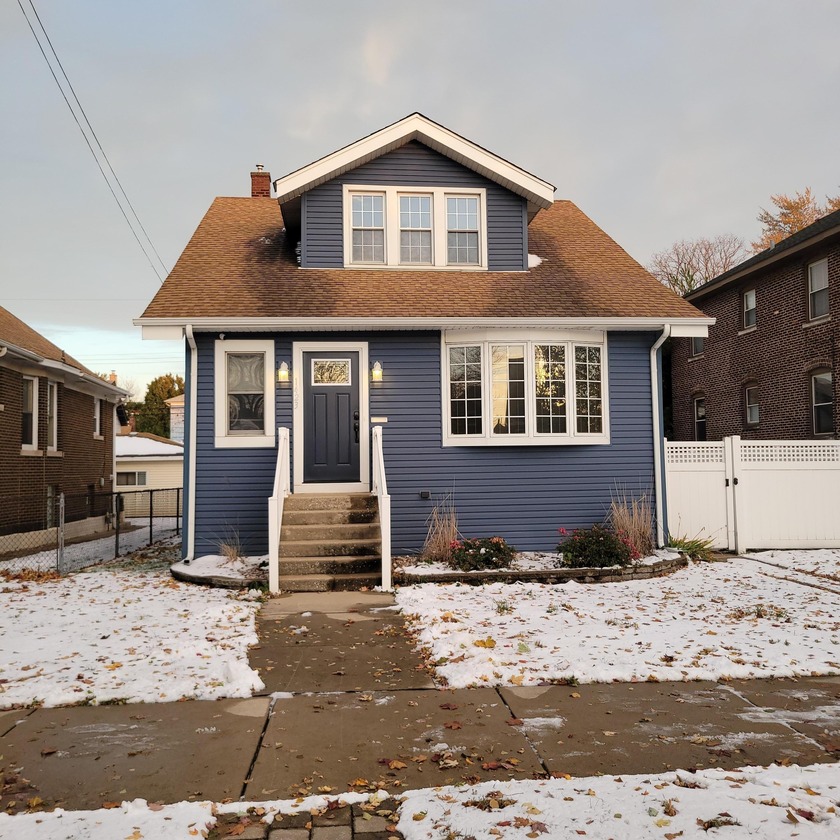 Sitting on an oversized lot is this spacious 3 bedroom home with - Beach Home for sale in Whiting, Indiana on Beachhouse.com