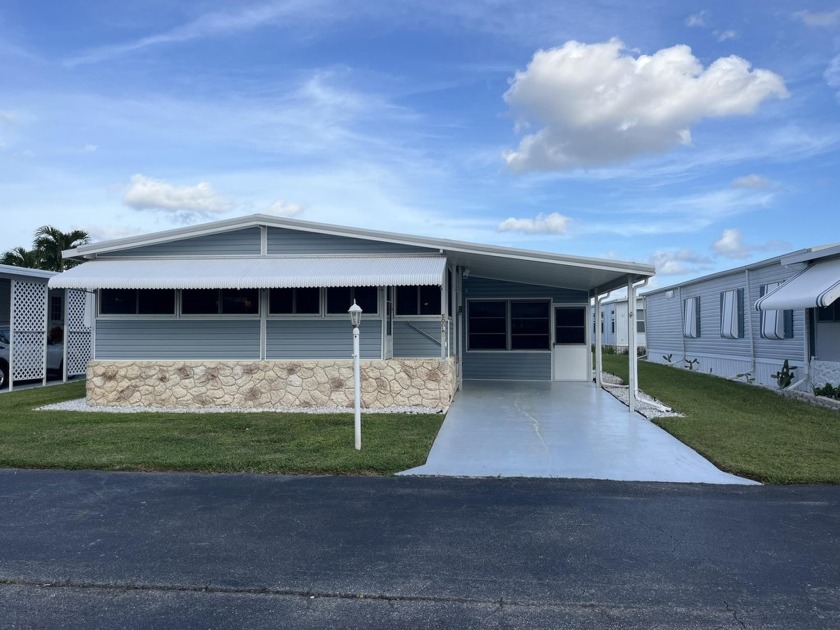 Charming double-wide mobile home located in the vibrant 55+ - Beach Home for sale in Boynton Beach, Florida on Beachhouse.com