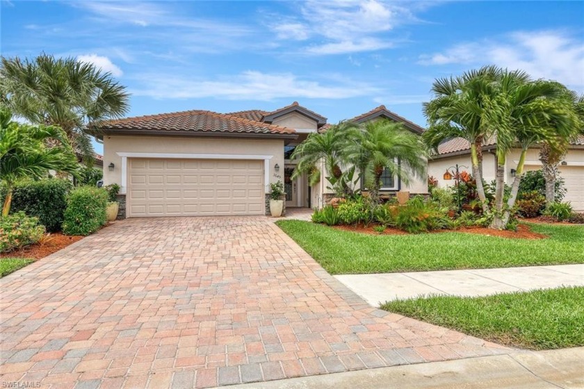 Through the community entry lined with royal palms is one of - Beach Home for sale in Naples, Florida on Beachhouse.com