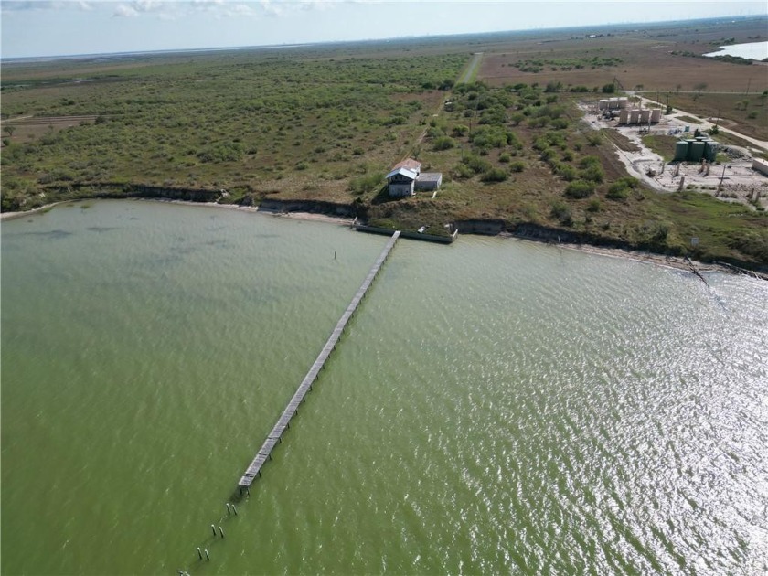 Bayfront Acreage with a pier! 4/3.5/2 Concrete with Stucco - Beach Home for sale in Taft, Texas on Beachhouse.com