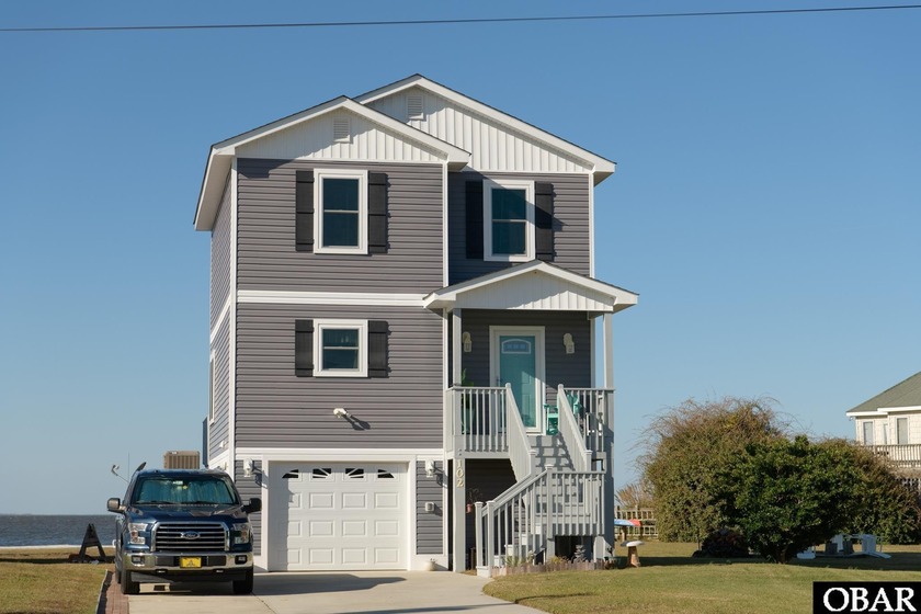 Experience waterfront living at its finest in this beautiful - Beach Home for sale in Kill Devil Hills, North Carolina on Beachhouse.com