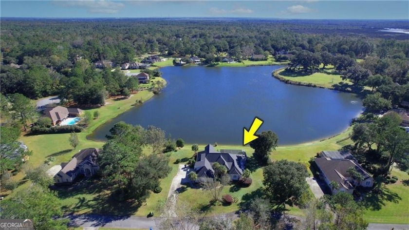 Experience lakefront living with a pool in this stunning - Beach Home for sale in Brunswick, Georgia on Beachhouse.com