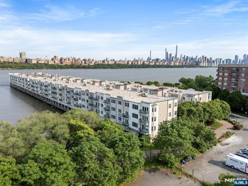 Experience the ultimate in waterfront living in this stunning - Beach Condo for sale in Edgewater, New Jersey on Beachhouse.com