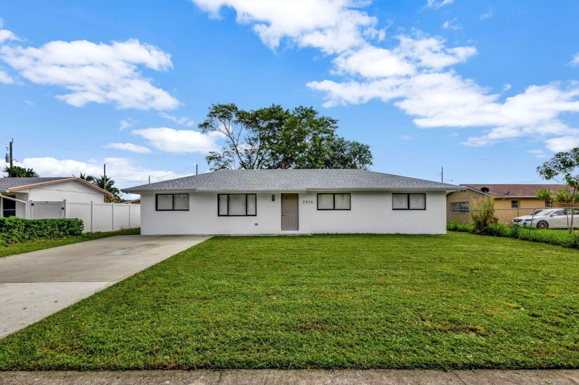 ***GORGEOUS 4 BEDROOMS 3 FULL BATHS BRAND NEW REBUILT HOME, WITH - Beach Home for sale in Riviera Beach, Florida on Beachhouse.com