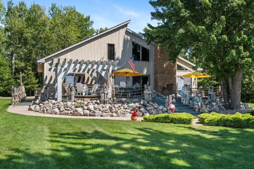 Experience lakeside luxury with this stunning 4 bed, 4 bath home - Beach Home for sale in Cheboygan, Michigan on Beachhouse.com